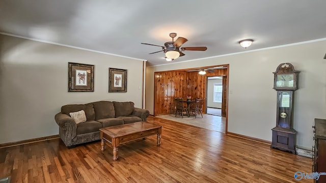 1411 W Washington St, Athens, AL 35611 - living room with crown molding, ceiling fan, baseboards, and wood finished floors