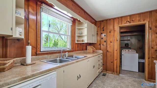 1411 W Washington St, Athens, AL 35611 - kitchen featuring white dishwasher, open shelves, a sink, light countertops, and washer / clothes dryer