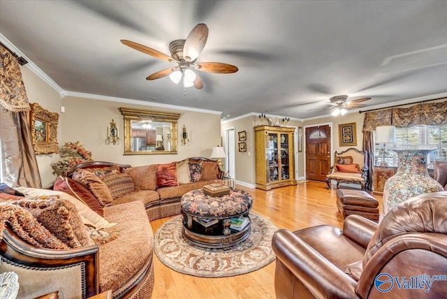 living room with light hardwood / wood-style floors, crown molding, and ceiling fan