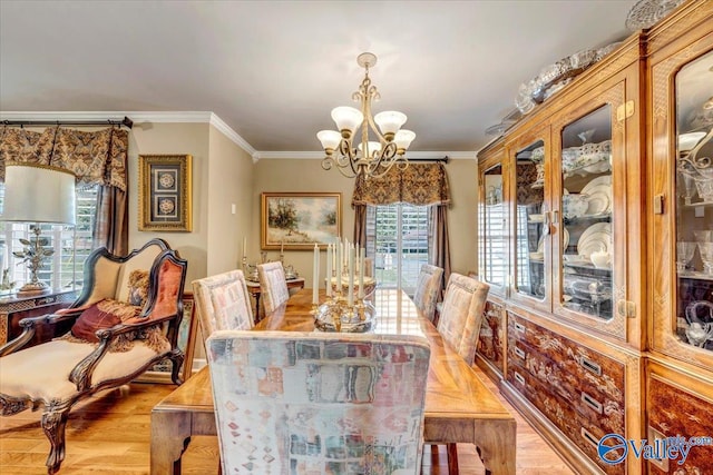 dining room with light hardwood / wood-style flooring, ornamental molding, and plenty of natural light