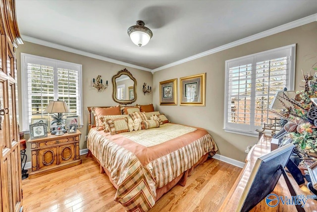 bedroom with ornamental molding, multiple windows, and light wood-type flooring