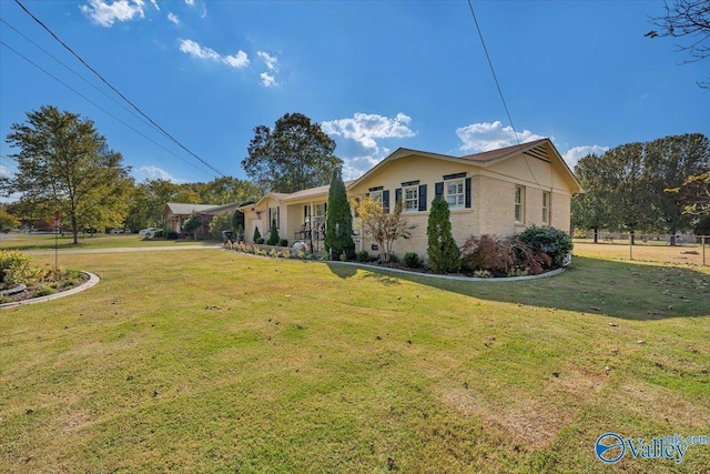 view of home's exterior featuring a lawn