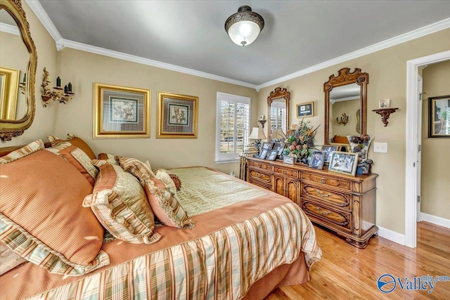 bedroom featuring light hardwood / wood-style floors and ornamental molding