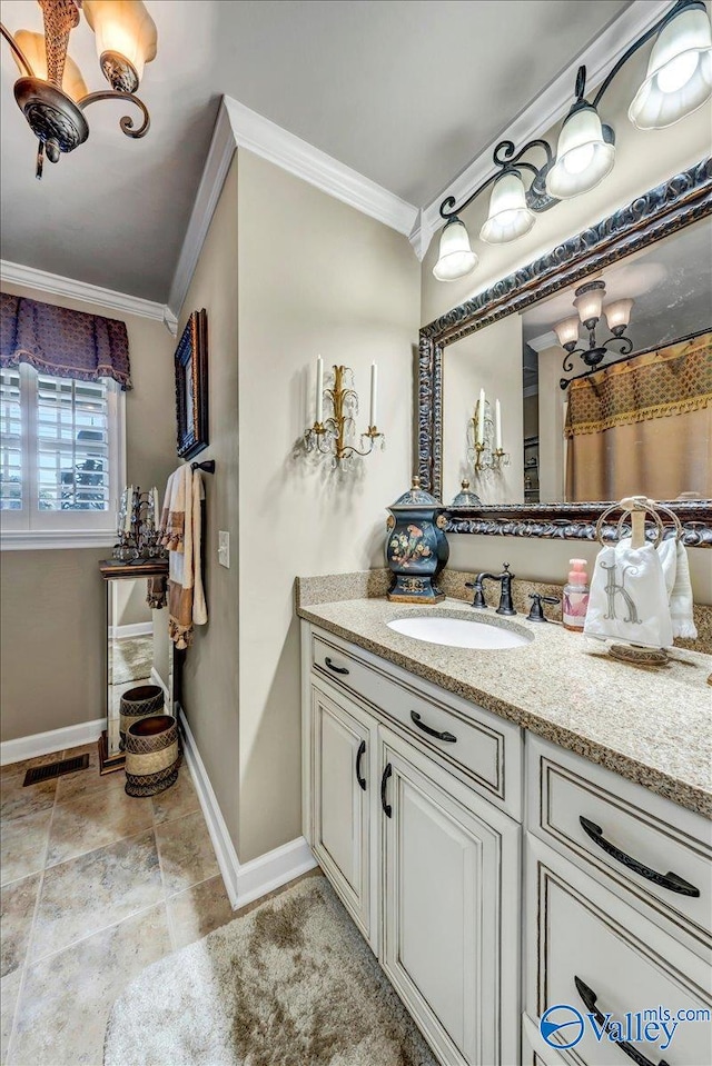 bathroom featuring vanity and ornamental molding