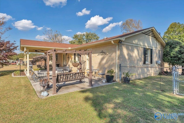 back of property featuring a yard and a patio