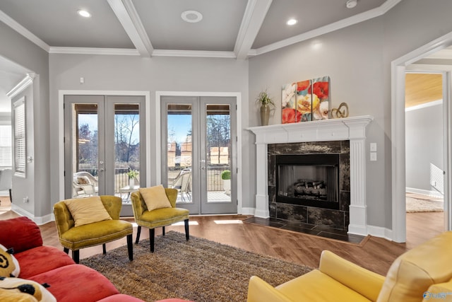 living room featuring french doors, crown molding, beam ceiling, a fireplace, and dark hardwood / wood-style floors