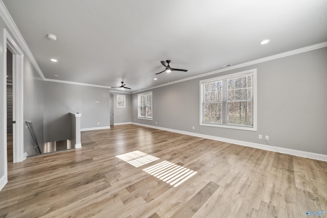 unfurnished living room with light wood-type flooring, ceiling fan, and ornamental molding