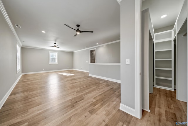 unfurnished room with light hardwood / wood-style floors, ceiling fan, and crown molding