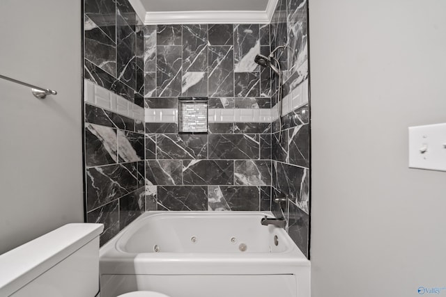 bathroom with toilet, ornamental molding, and bathtub / shower combination