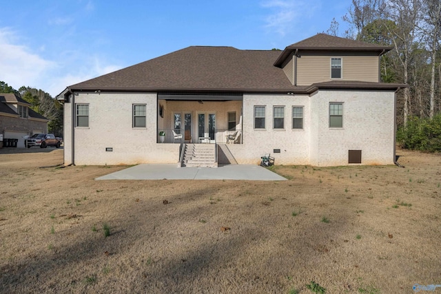 rear view of property with a porch and a lawn