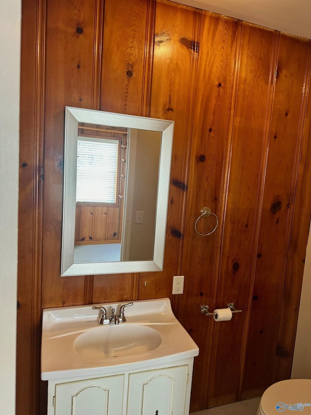 514 Marsheutz Ave SW, Huntsville, AL 35801 - bathroom featuring toilet, wood walls, and vanity