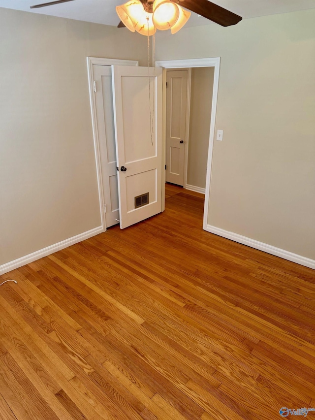 514 Marsheutz Ave SW, Huntsville, AL 35801 - unfurnished room featuring light wood finished floors, baseboards, and a ceiling fan