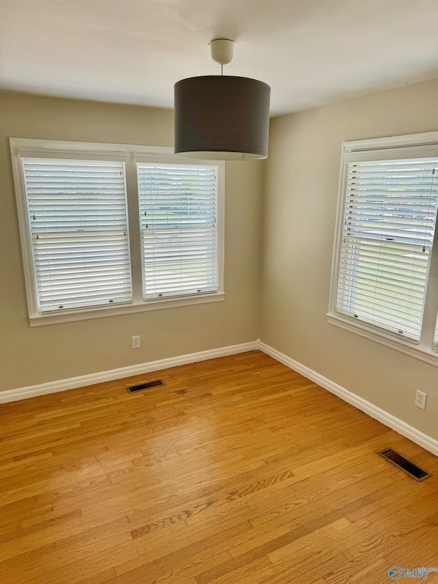 514 Marsheutz Ave SW, Huntsville, AL 35801 - empty room featuring visible vents, baseboards, and light wood-type flooring