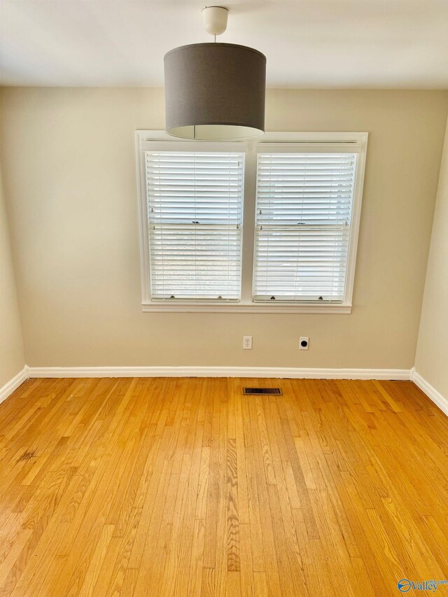 514 Marsheutz Ave SW, Huntsville, AL 35801 - spare room with visible vents, baseboards, and light wood-style floors