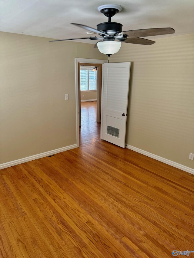 514 Marsheutz Ave SW, Huntsville, AL 35801 - spare room featuring light wood-style floors, ceiling fan, and baseboards