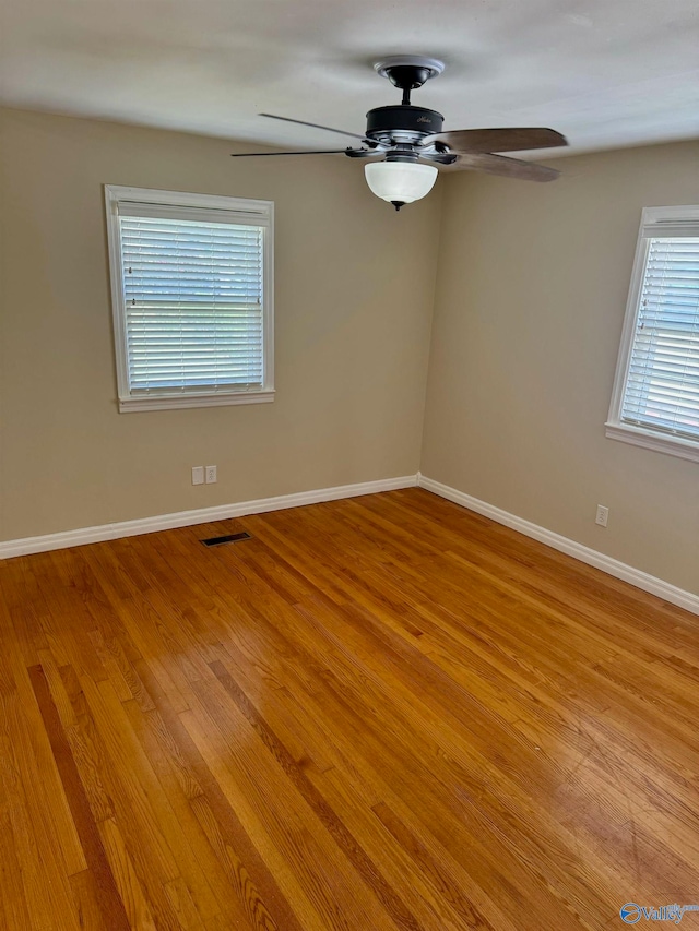 spare room with ceiling fan and light hardwood / wood-style flooring