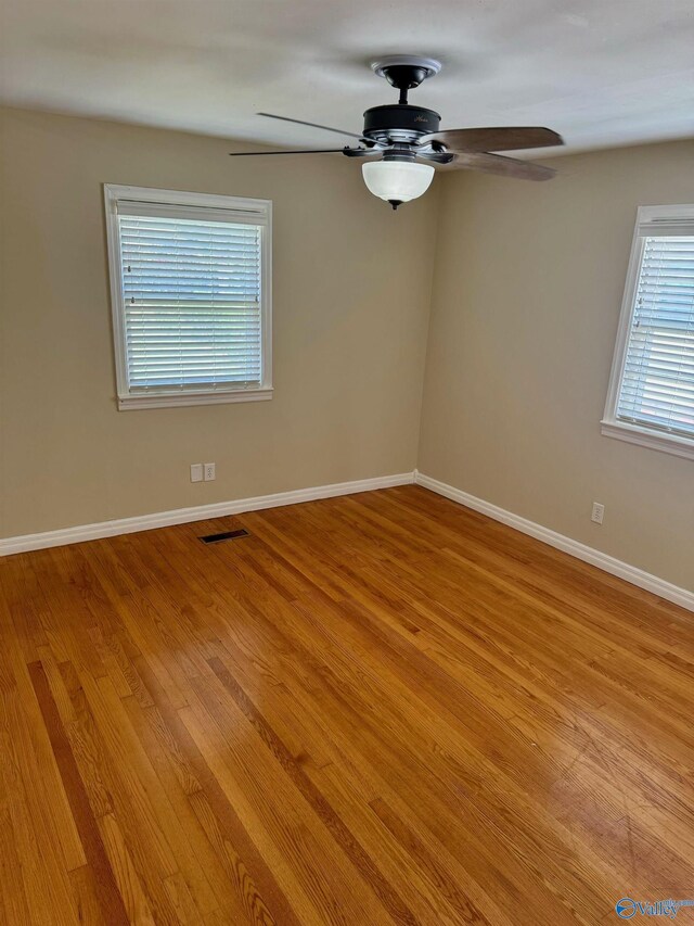 514 Marsheutz Ave SW, Huntsville, AL 35801 - empty room with plenty of natural light, visible vents, light wood-type flooring, and ceiling fan