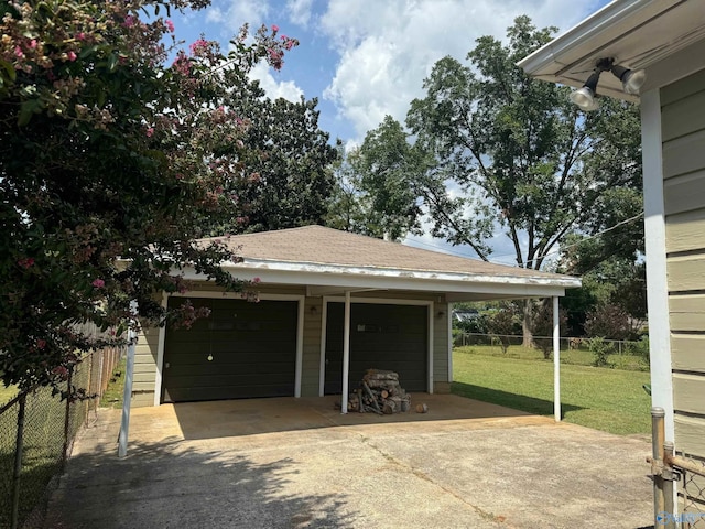 garage featuring a yard