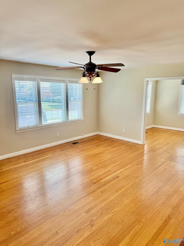 514 Marsheutz Ave SW, Huntsville, AL 35801 - empty room with visible vents, baseboards, light wood finished floors, and a ceiling fan