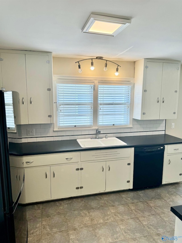 514 Marsheutz Ave SW, Huntsville, AL 35801 - kitchen featuring tasteful backsplash, a sink, black appliances, and dark countertops