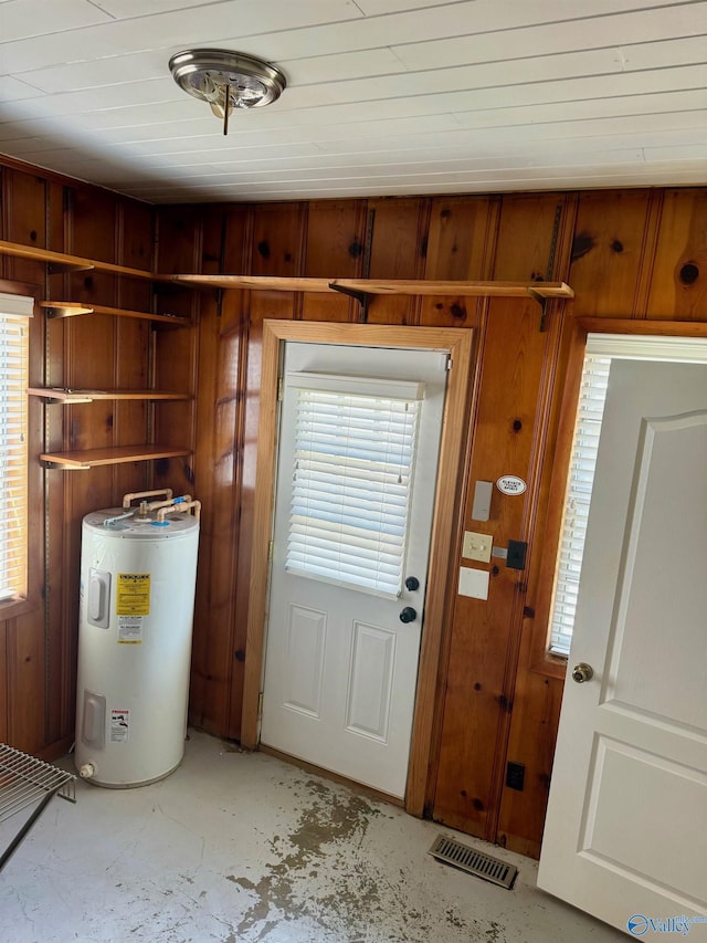 514 Marsheutz Ave SW, Huntsville, AL 35801 - doorway with concrete floors, visible vents, a wealth of natural light, electric water heater, and wood walls