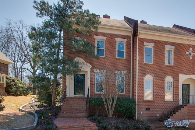 view of front of home featuring brick siding