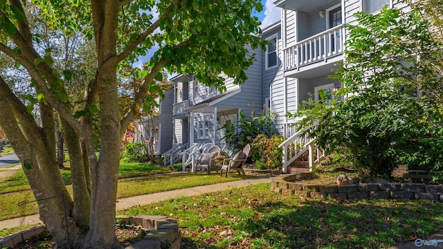 412 Market St, Scottsboro, AL 35768 - view of front of house with a balcony and stairway