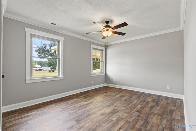 empty room featuring ceiling fan, dark hardwood / wood-style floors, ornamental molding, and a textured ceiling