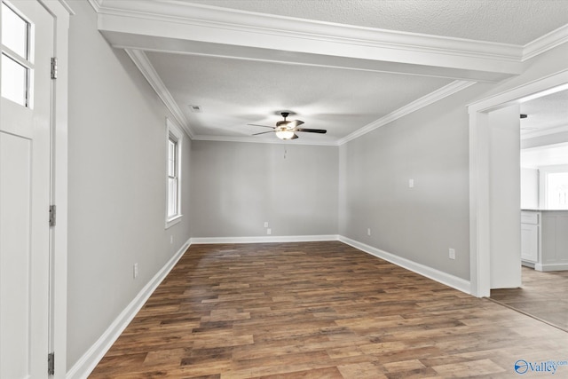 unfurnished room with plenty of natural light, ceiling fan, and dark hardwood / wood-style floors