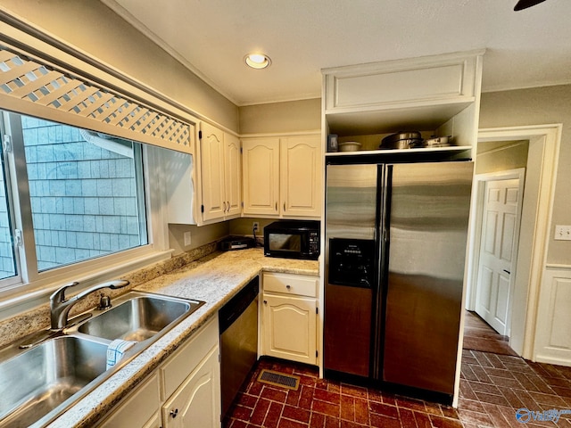 kitchen featuring sink, white cabinets, and appliances with stainless steel finishes