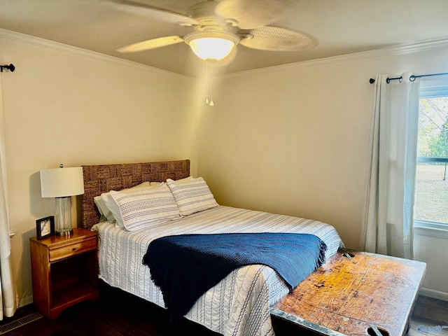 bedroom featuring ceiling fan, dark hardwood / wood-style floors, crown molding, and multiple windows