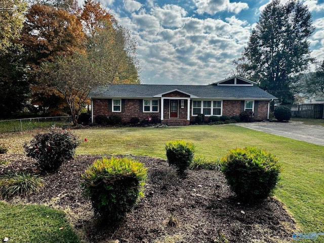 ranch-style home with a front lawn