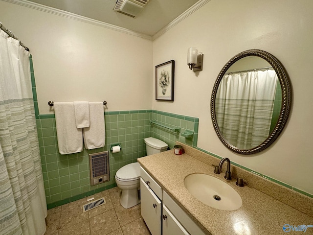 bathroom featuring toilet, tile walls, tile patterned floors, heating unit, and crown molding