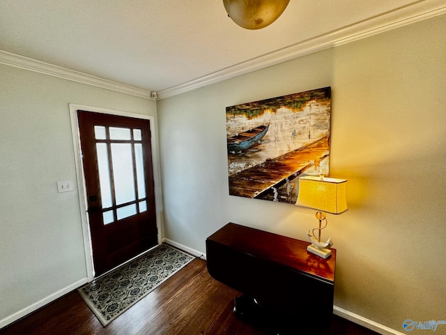 entryway with ornamental molding and dark hardwood / wood-style flooring