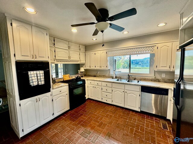 kitchen with ceiling fan, sink, white cabinetry, and black appliances