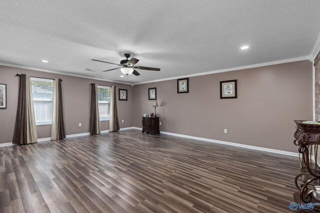 unfurnished living room featuring ornamental molding, dark wood-style flooring, and baseboards