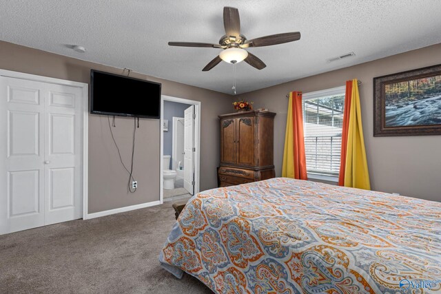 bedroom with carpet floors, a ceiling fan, visible vents, and a textured ceiling