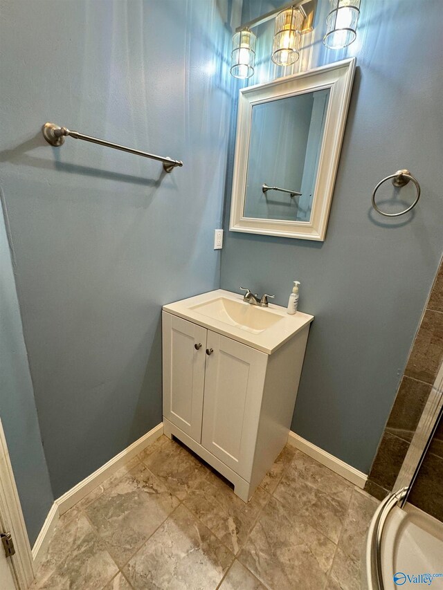 bathroom featuring vanity and baseboards