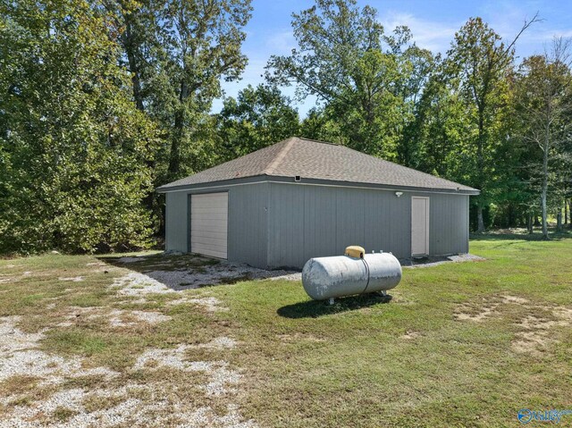 detached garage featuring driveway