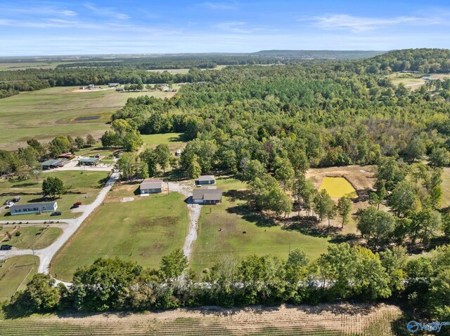 bird's eye view featuring a rural view and a wooded view