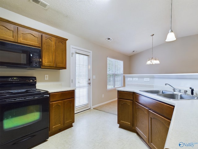 kitchen with sink, a notable chandelier, vaulted ceiling, decorative light fixtures, and black appliances