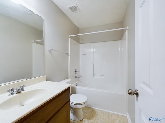 full bathroom with bathing tub / shower combination, vanity, a textured ceiling, and toilet