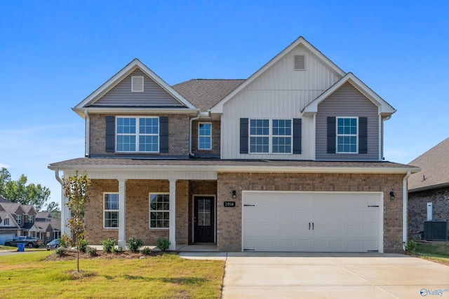 view of front facade featuring a garage, a porch, central air condition unit, and a front lawn