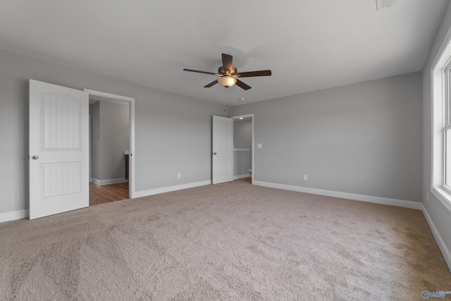 unfurnished bedroom with carpet floors and ceiling fan