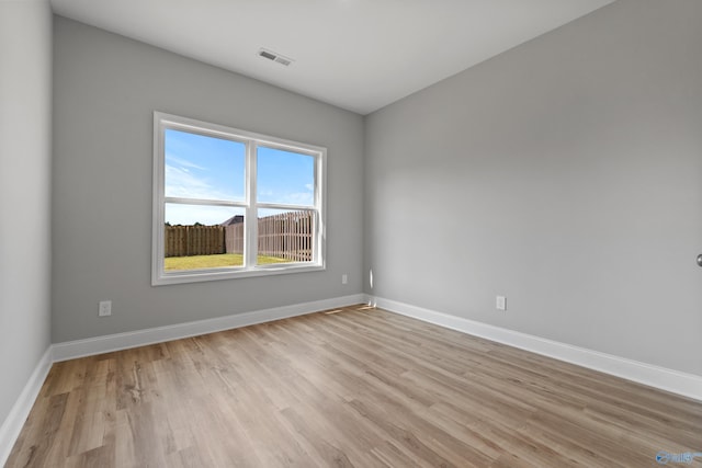 spare room featuring light hardwood / wood-style flooring