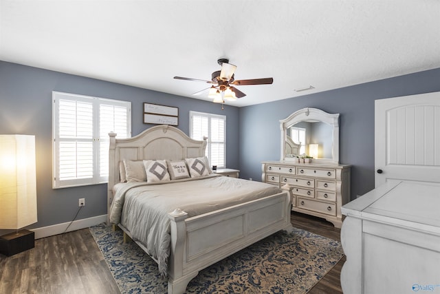 bedroom featuring dark wood-type flooring and ceiling fan