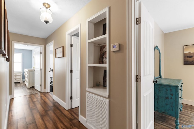 hallway with dark wood-type flooring