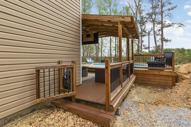 wooden deck featuring a swimming pool