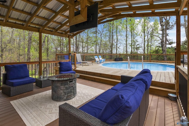 exterior space with a gazebo and an outdoor living space with a fire pit