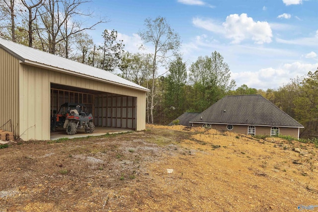 view of home's exterior featuring an outdoor structure